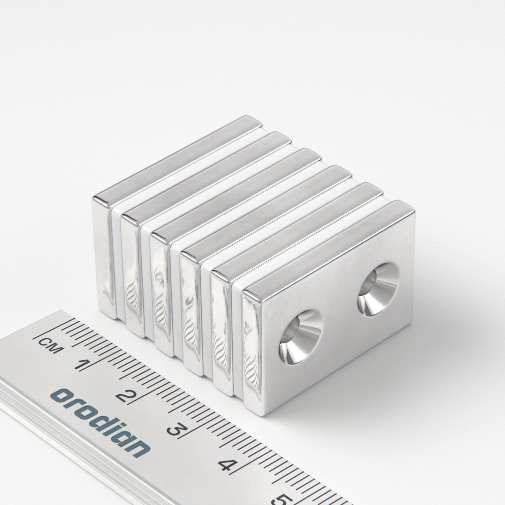 Neodýmový magnet kváder 30×20×4 mm s 2 dierami M4 (južný pól na strane s priehlbinami) - N38