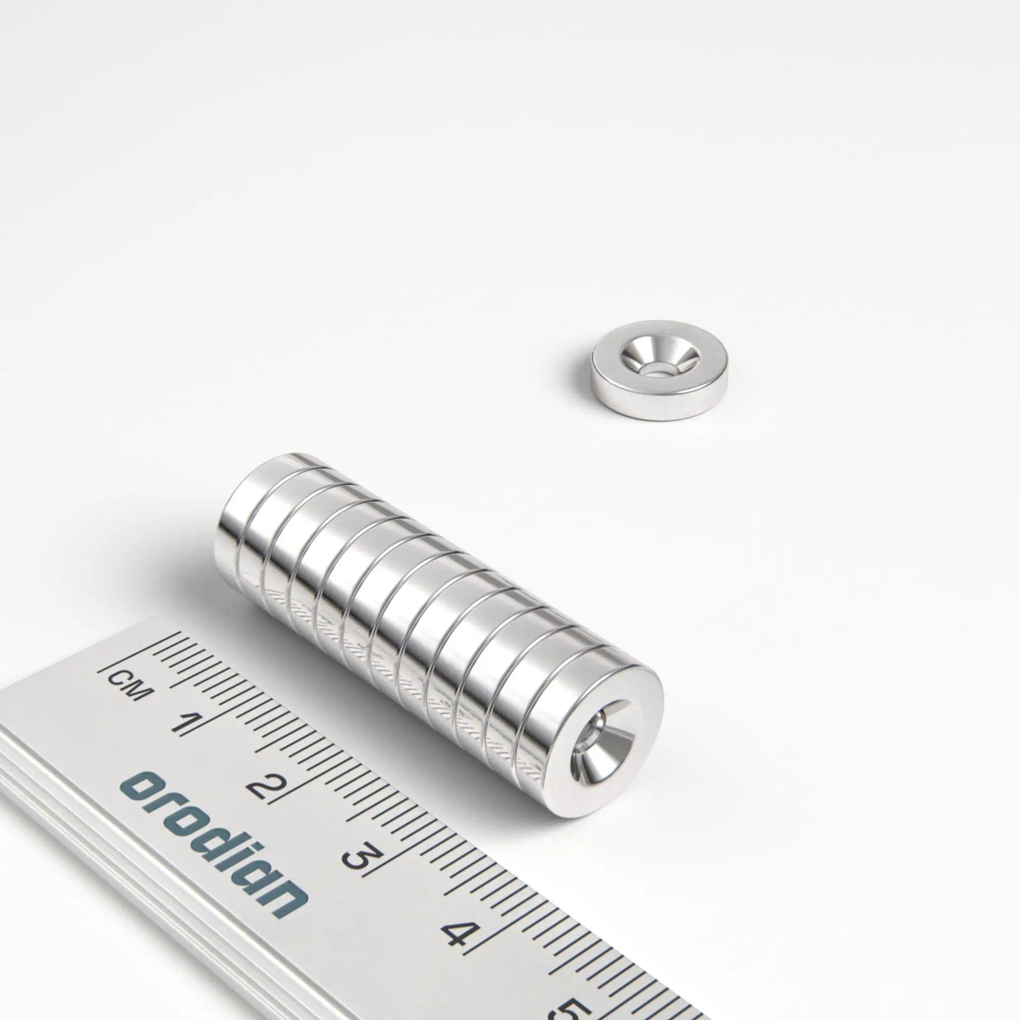Neodýmový magnet valec 12×3 mm s dierou M3 (severný pól na strane s priehlbinou) - N38