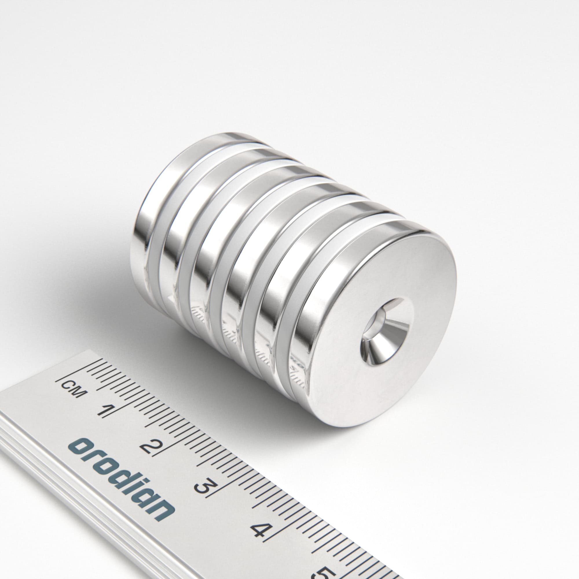 Neodýmový magnet valec 27×4 mm s dierou M4 (severný pól na strane s priehlbinou) - N38