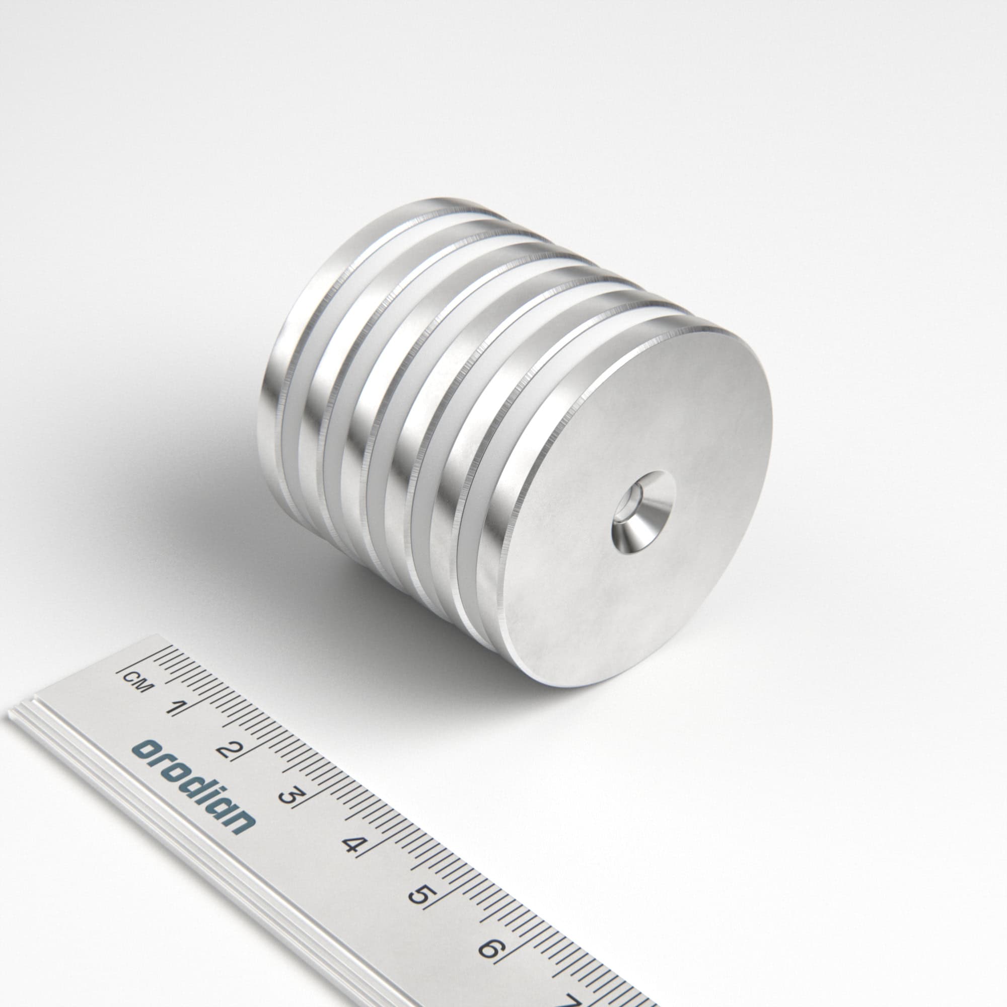 Neodýmový magnet valec 42×4 mm s dierou M4 (južný pól na strane s priehlbinou) - N38